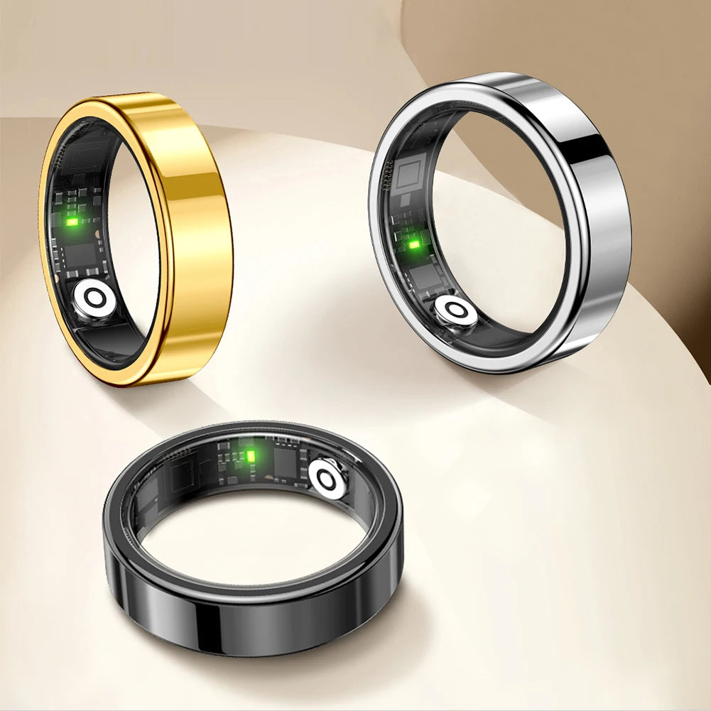 Three futuristic rings in gold, silver, and black on a beige background